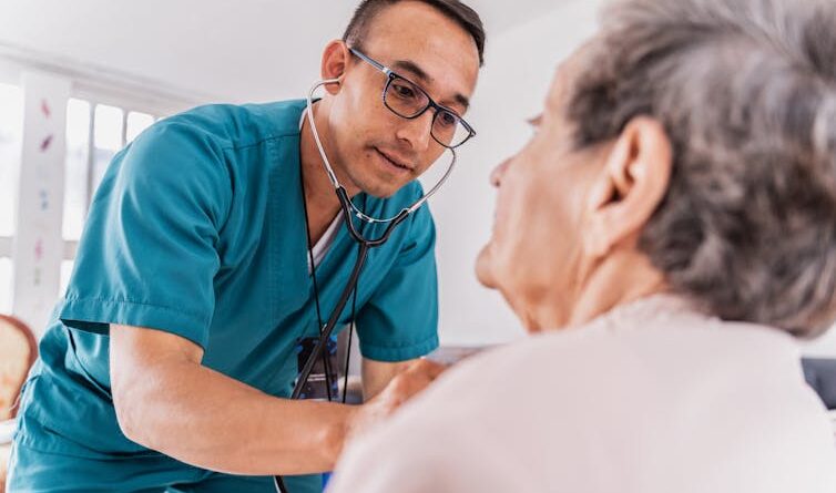 The nurse listened to the heart of a high woman during medical communication